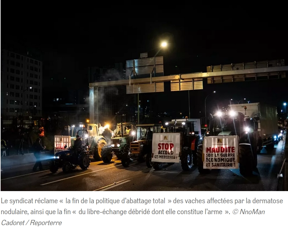 Photo Reporterre un tracteur avec banderole maudite soit la guerre économique et sanitaire